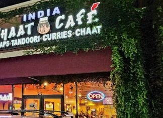 Discover the Top 10 Indian Restaurants in Dallas, TX – A Culinary Journey Nighttime view of Indian Chaat Cafe - A vibrant and bustling Indian restaurant illuminated with warm lights, creating a lively and inviting atmosphere